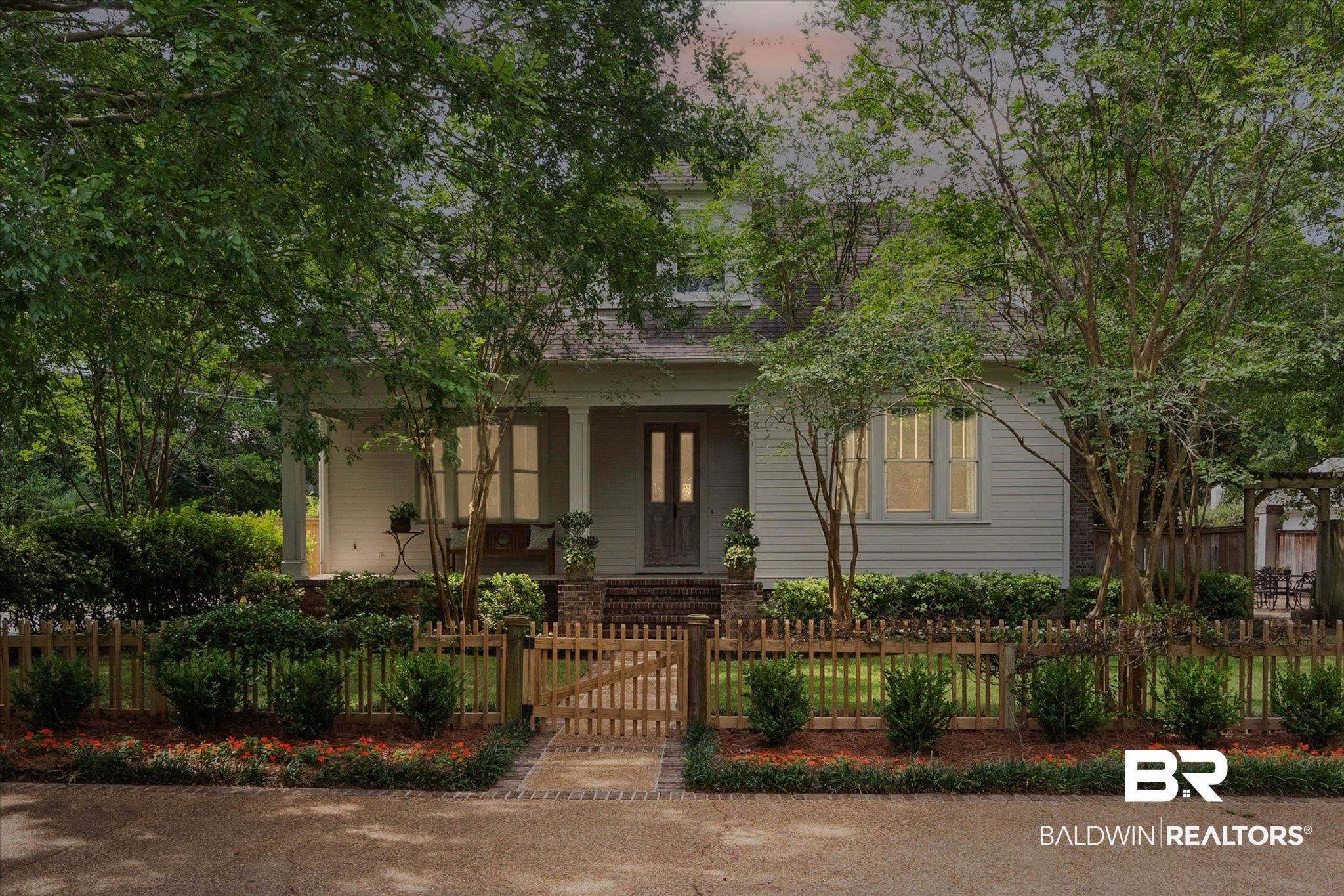 3813 Austill Lane Mobile, AL 36608 - Photo 34 of 37 Traditional residence featuring a covered porch with column supports, siding exterior, and a brick foundation