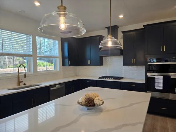 a kitchen with a sink and a stove