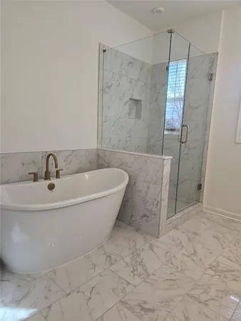a white bath tub sitting in a bathroom