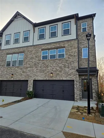 a front view of a house with a large windows