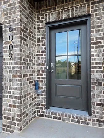 a bathroom with a shower and a sink