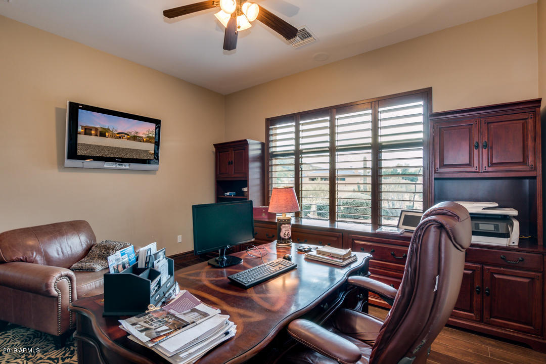 318 West Rock View Road Phoenix, AZ 85085 - Photo 29 of 105 a view of a workspace with furniture and a window