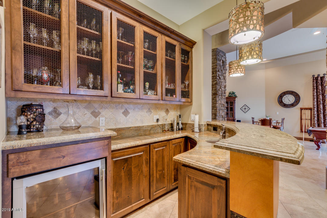 318 West Rock View Road Phoenix, AZ 85085 - Photo 38 of 105 a kitchen with a sink and a refrigerator