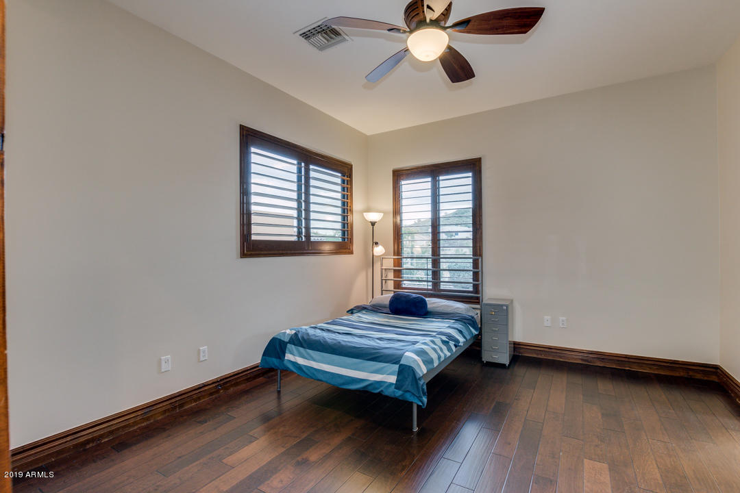 318 West Rock View Road Phoenix, AZ 85085 - Photo 52 of 105 a bedroom with bed and window