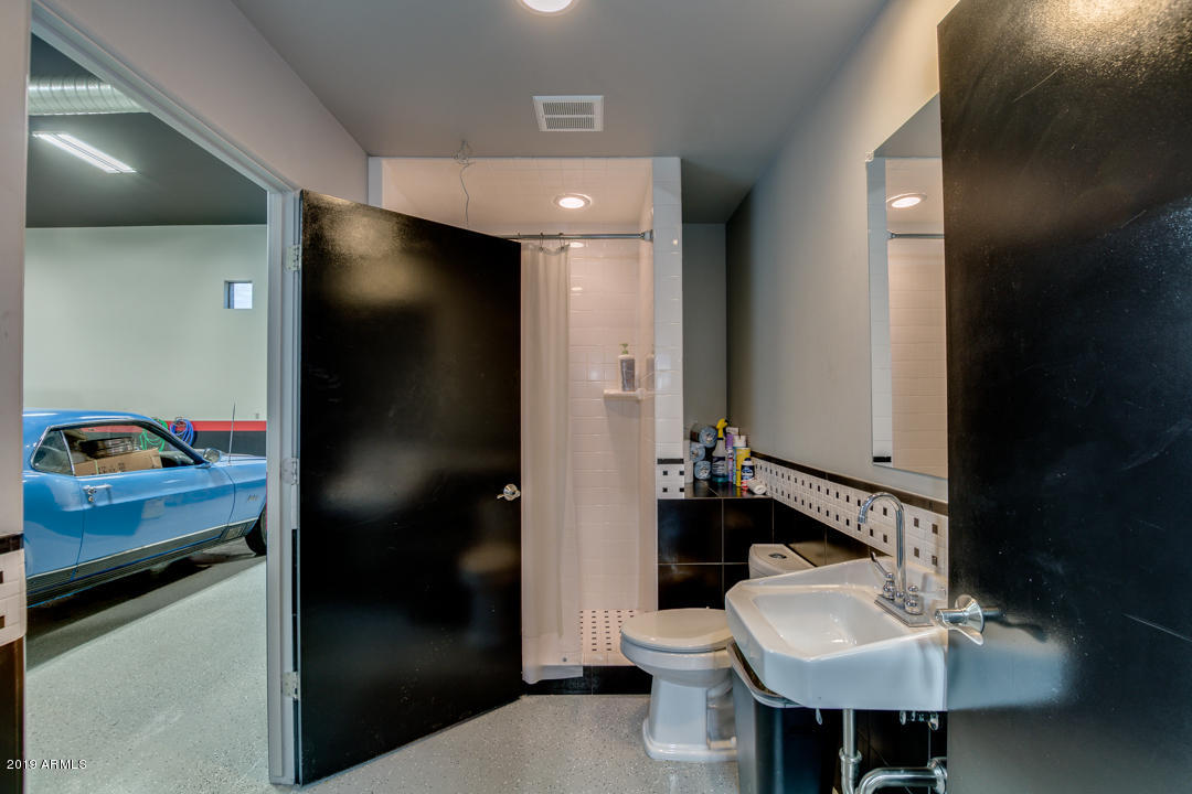 318 West Rock View Road Phoenix, AZ 85085 - Photo 65 of 105 a bathroom with a sink a toilet and shower