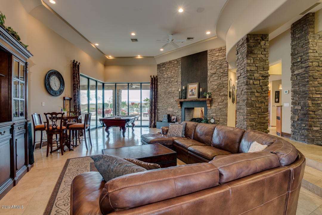 318 West Rock View Road Phoenix, AZ 85085 - Photo 8 of 105 a living room with furniture and a large window