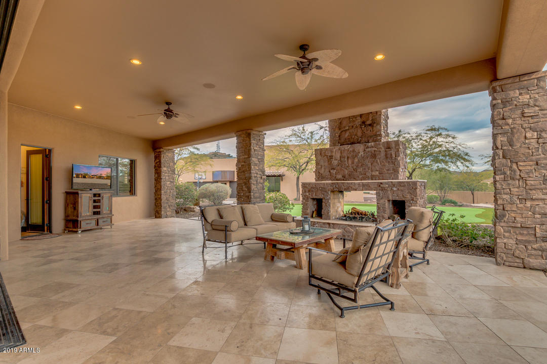 318 West Rock View Road Phoenix, AZ 85085 - Photo 82 of 105 a living room with fireplace furniture and a large window