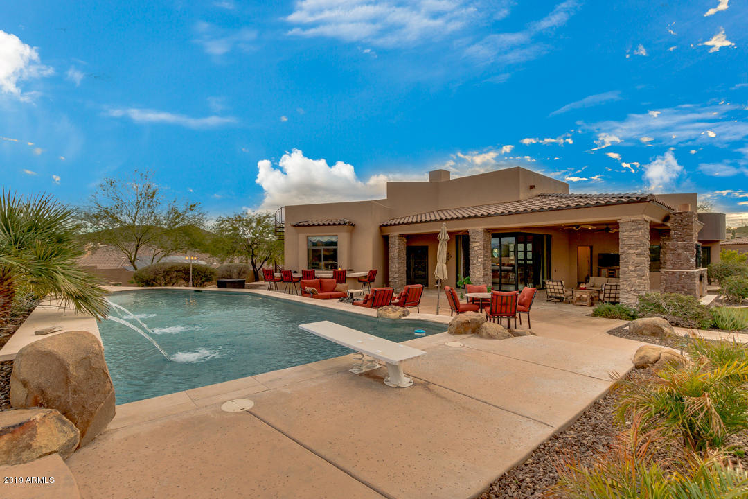 318 West Rock View Road Phoenix, AZ 85085 - Photo 90 of 105 a view of a house with backyard porch and sitting area