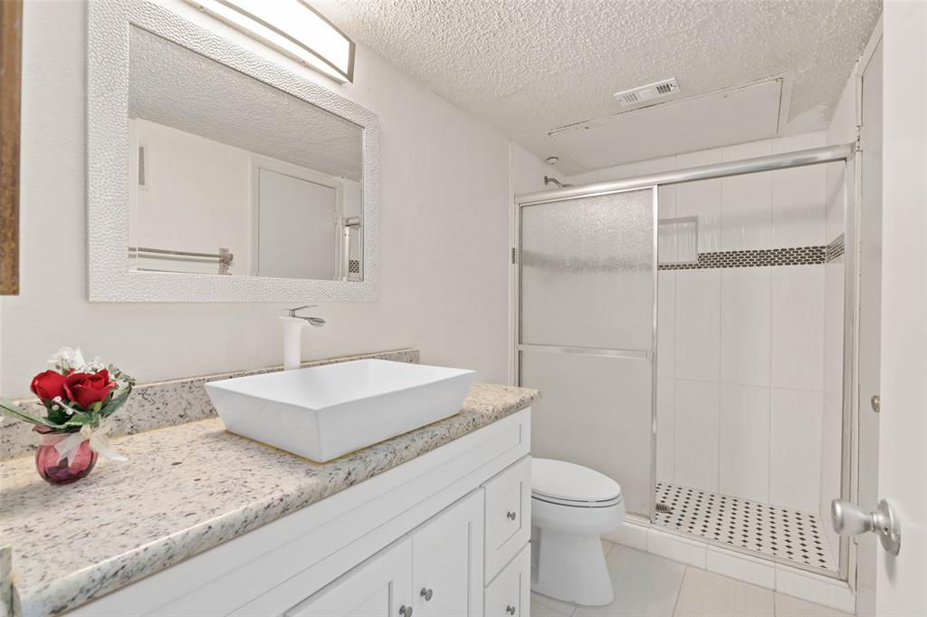 700 West Collins Street Denton, TX 76201 - Photo 24 of 36 Upstairs bathroom is connected to primary bedroom and hallway