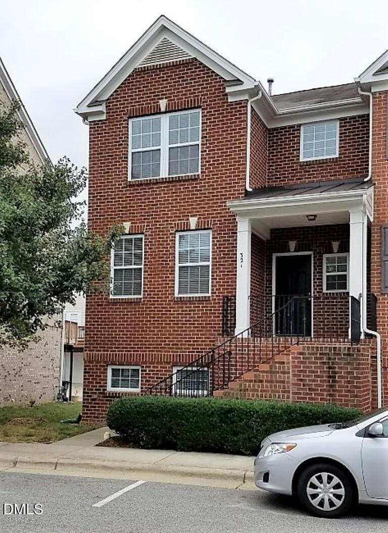 a front view of a house with garage