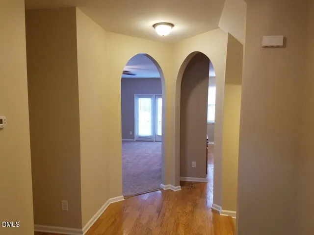 a view of front door with wooden floor