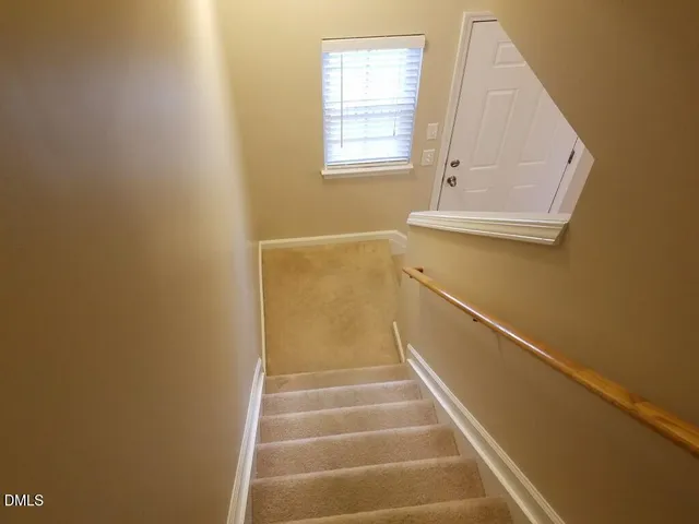 a bathroom with a shower and a glass door