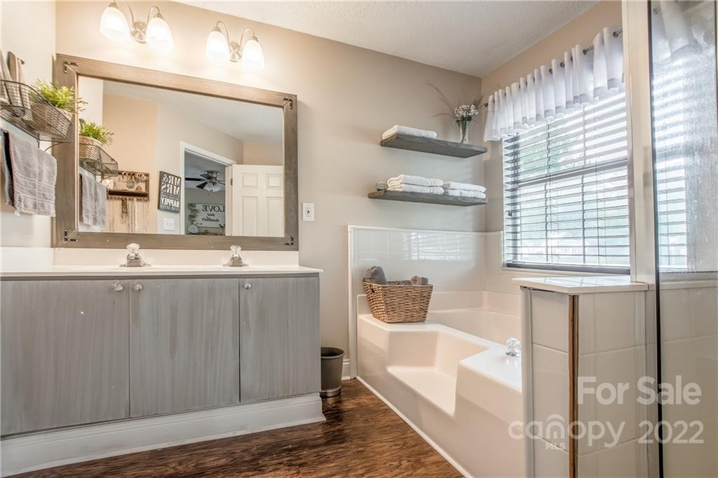 5901 Creft Circle Indian Trail, NC 28079 - Photo 14 of 26 a bathroom with a sink and a mirror