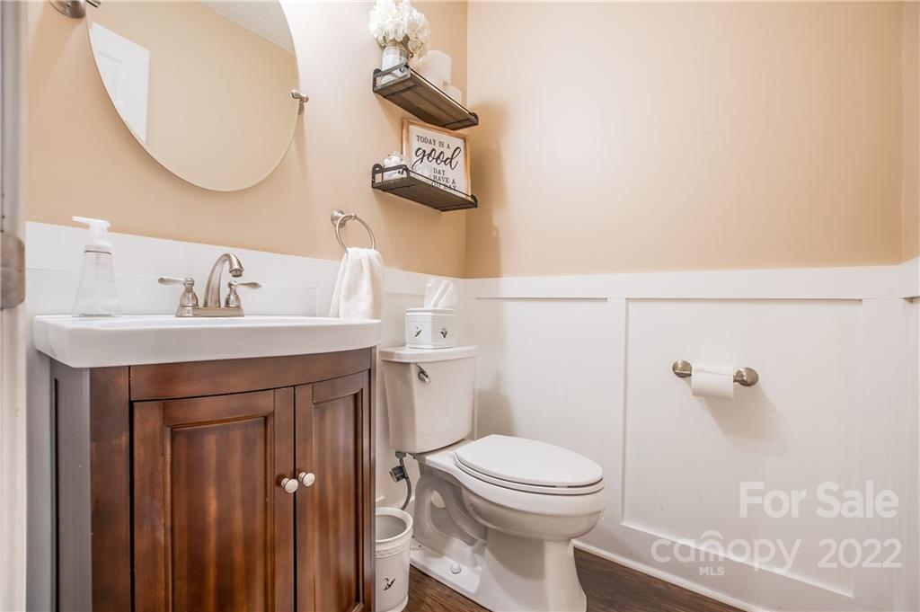 5901 Creft Circle Indian Trail, NC 28079 - Photo 17 of 26 a bathroom with a sink a toilet and a mirror