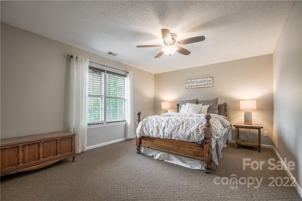 5901 Creft Circle Indian Trail, NC 28079 - Photo 18 of 26 a bedroom with a bed and a window