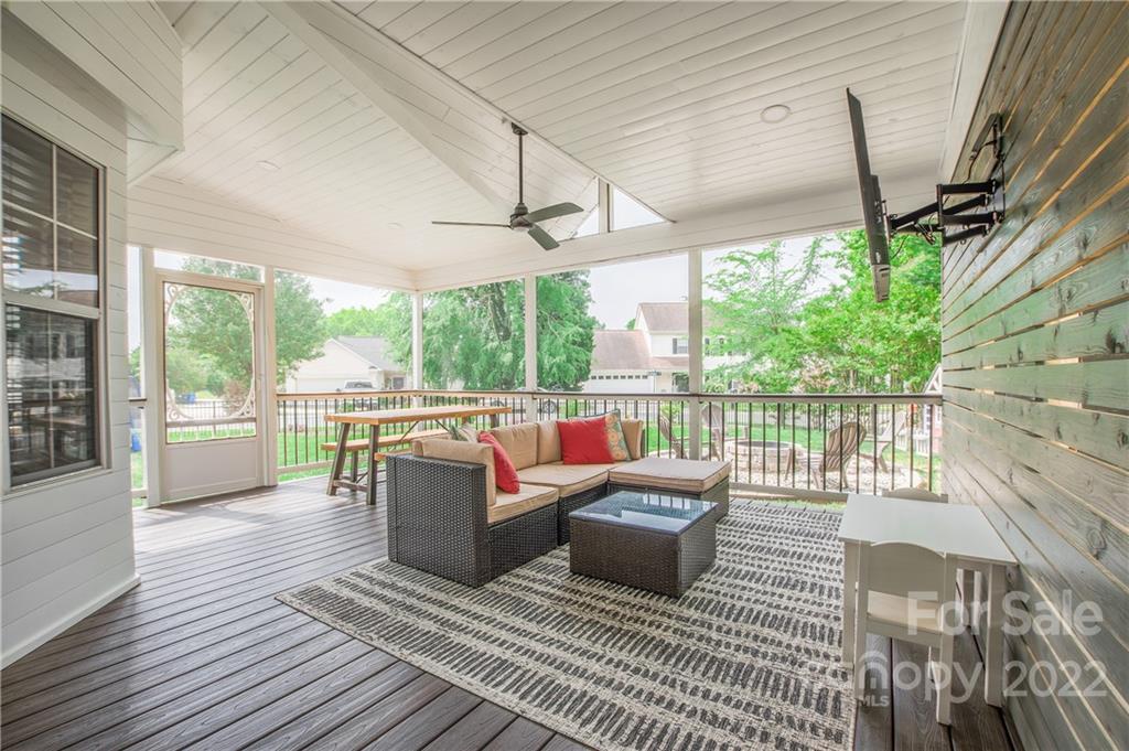 5901 Creft Circle Indian Trail, NC 28079 - Photo 22 of 26 a living room with furniture and a floor to ceiling window
