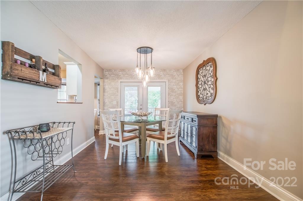 5901 Creft Circle Indian Trail, NC 28079 - Photo 7 of 26 a view of a dining room with furniture window and wooden floor