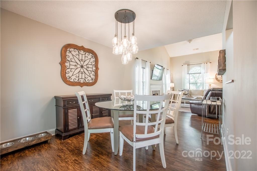 5901 Creft Circle Indian Trail, NC 28079 - Photo 8 of 26 a view of a dining room with furniture window and wooden floor