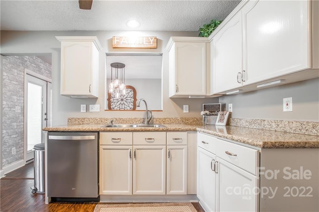 5901 Creft Circle Indian Trail, NC 28079 - Photo 10 of 26 a kitchen with granite countertop a sink and cabinets