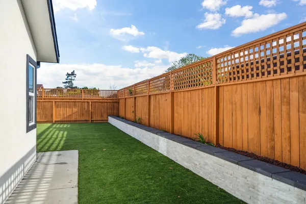 a view of a backyard with potted plants
