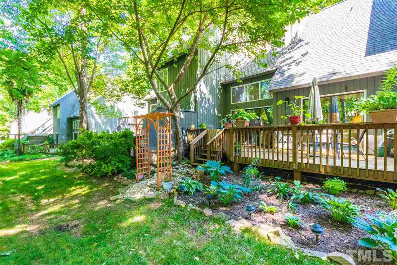 4339 Southwind Drive Raleigh, NC 27613 - Photo 23 of 24 a view of a garden with a deck