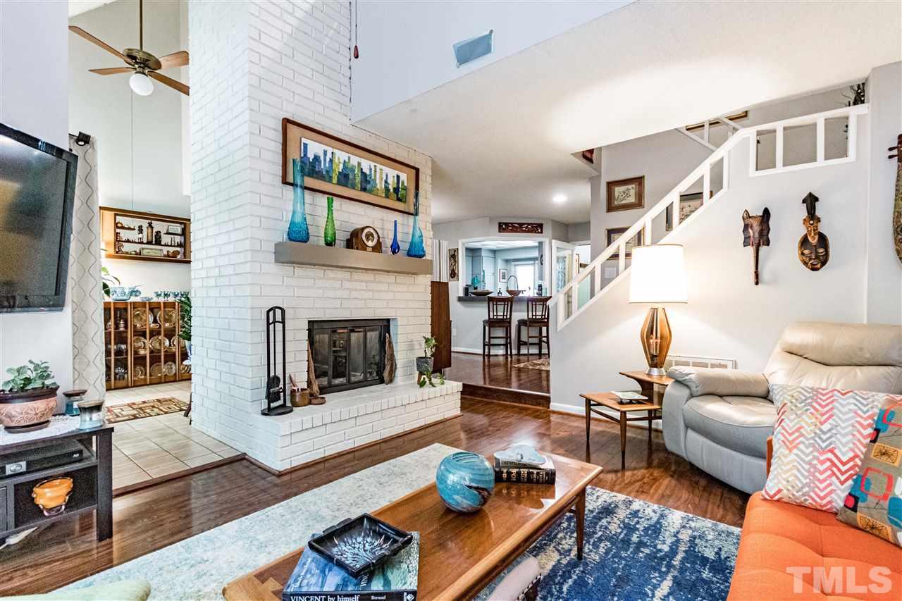 4339 Southwind Drive Raleigh, NC 27613 - Photo 10 of 24 a living room with furniture and a fireplace