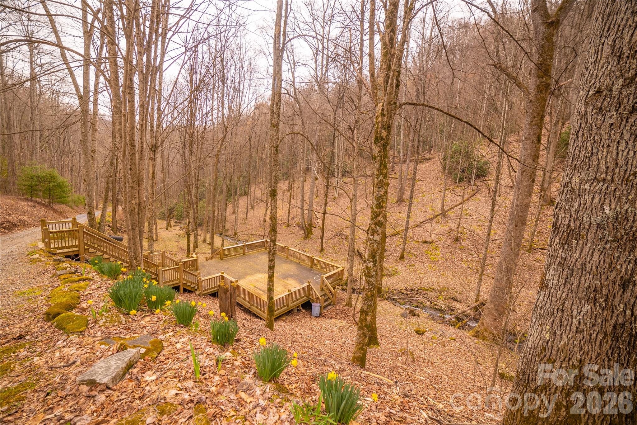 682 Rock House Road Hot Springs, NC 28743 - Photo 38 of 43 a backyard of a house with yard and outdoor seating