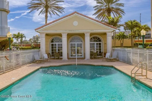 a swimming pool with outdoor seating