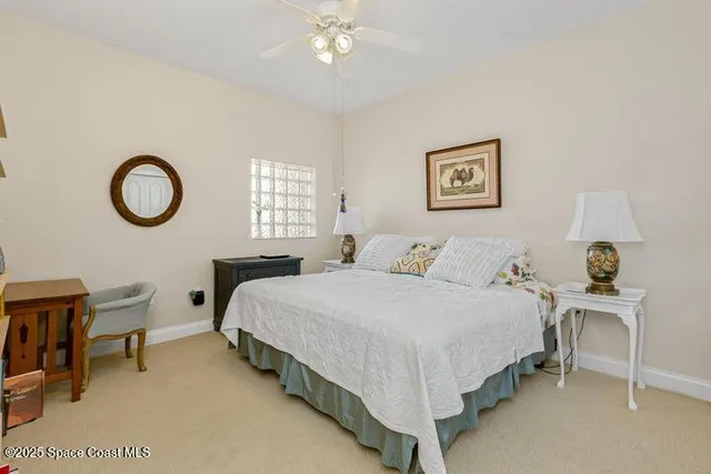 a bedroom with bed and a window