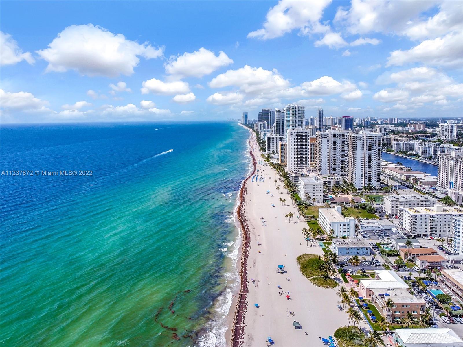 a view of a city with an ocean