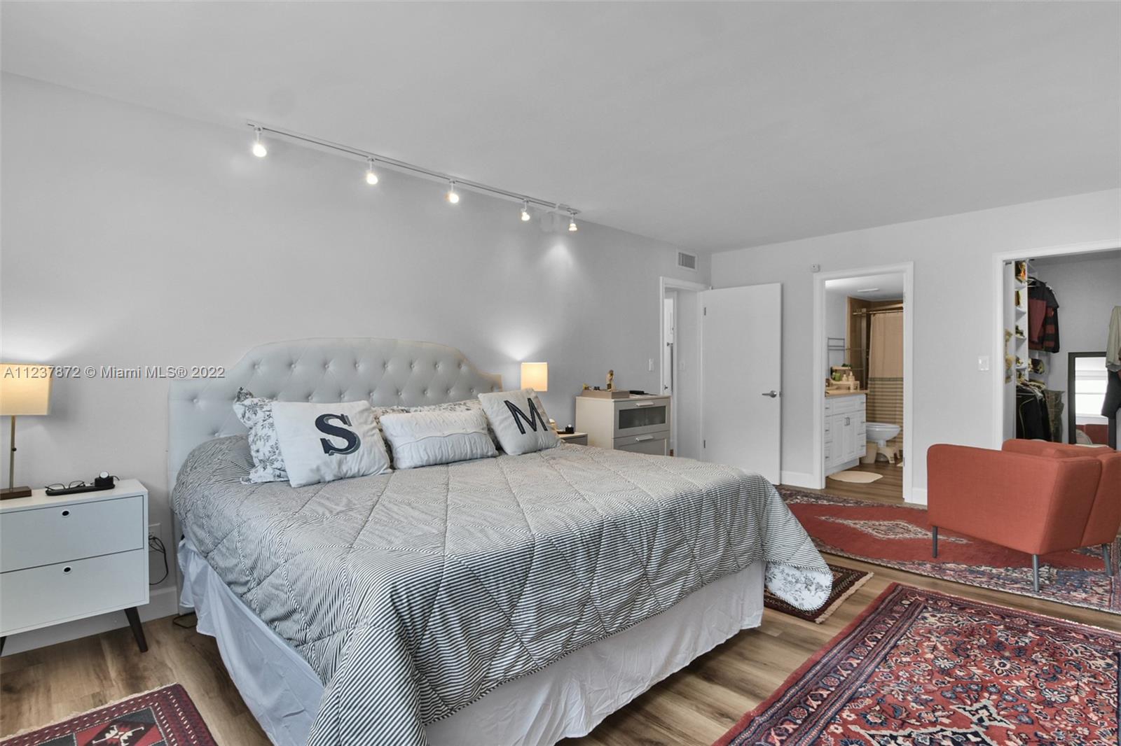 South Central Beach Hollywood, FL 33019 - Photo 13 of 30 a bedroom with double bed and a couch