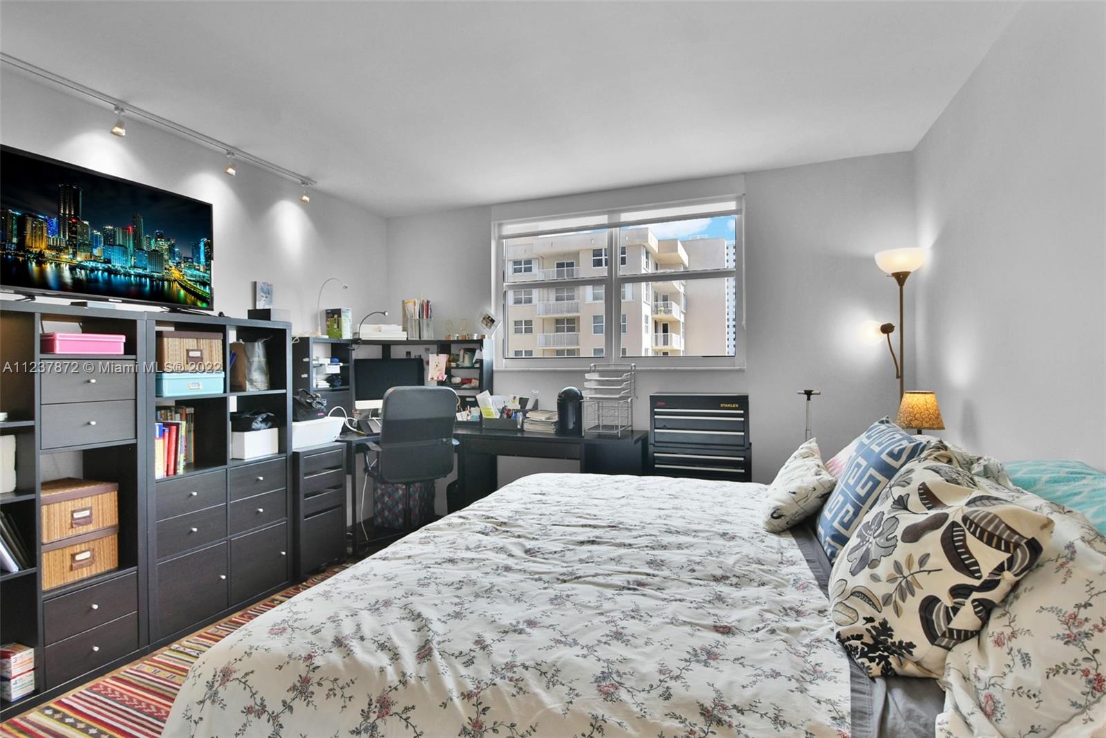 South Central Beach Hollywood, FL 33019 - Photo 16 of 30 a bedroom with a bed and a television