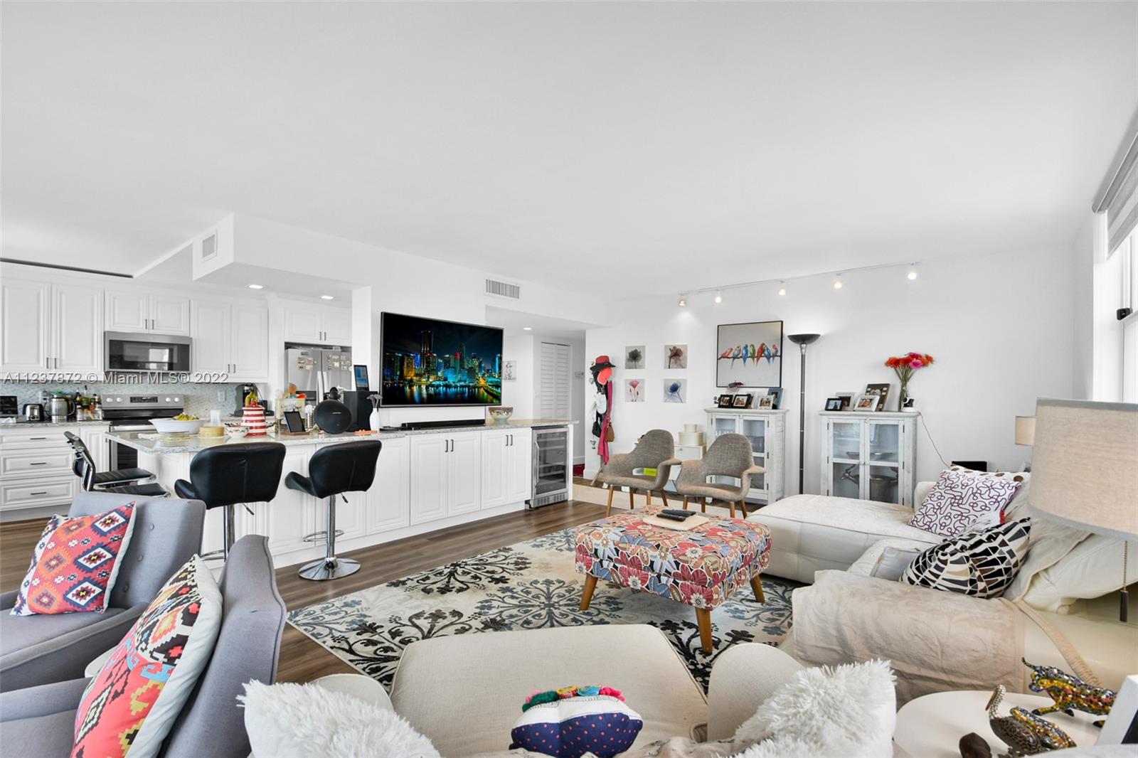 South Central Beach Hollywood, FL 33019 - Photo 20 of 30 a living room with furniture and a flat screen tv