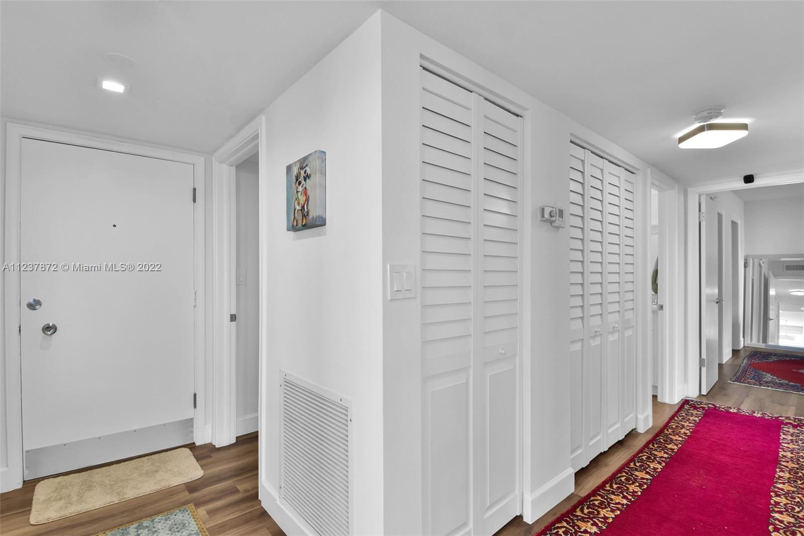 South Central Beach Hollywood, FL 33019 - Photo 27 of 30 a view of room with walk in closet and wooden floor
