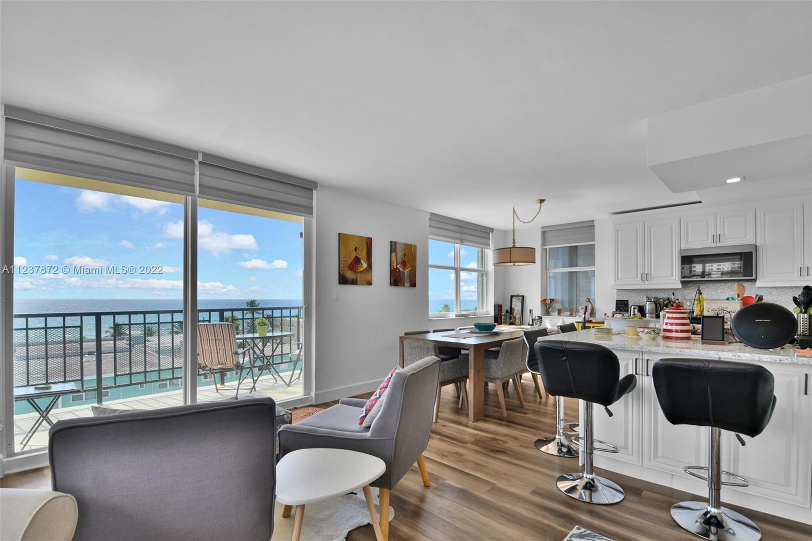 South Central Beach Hollywood, FL 33019 - Photo 4 of 30 a view of a dining room with furniture window and wooden floor