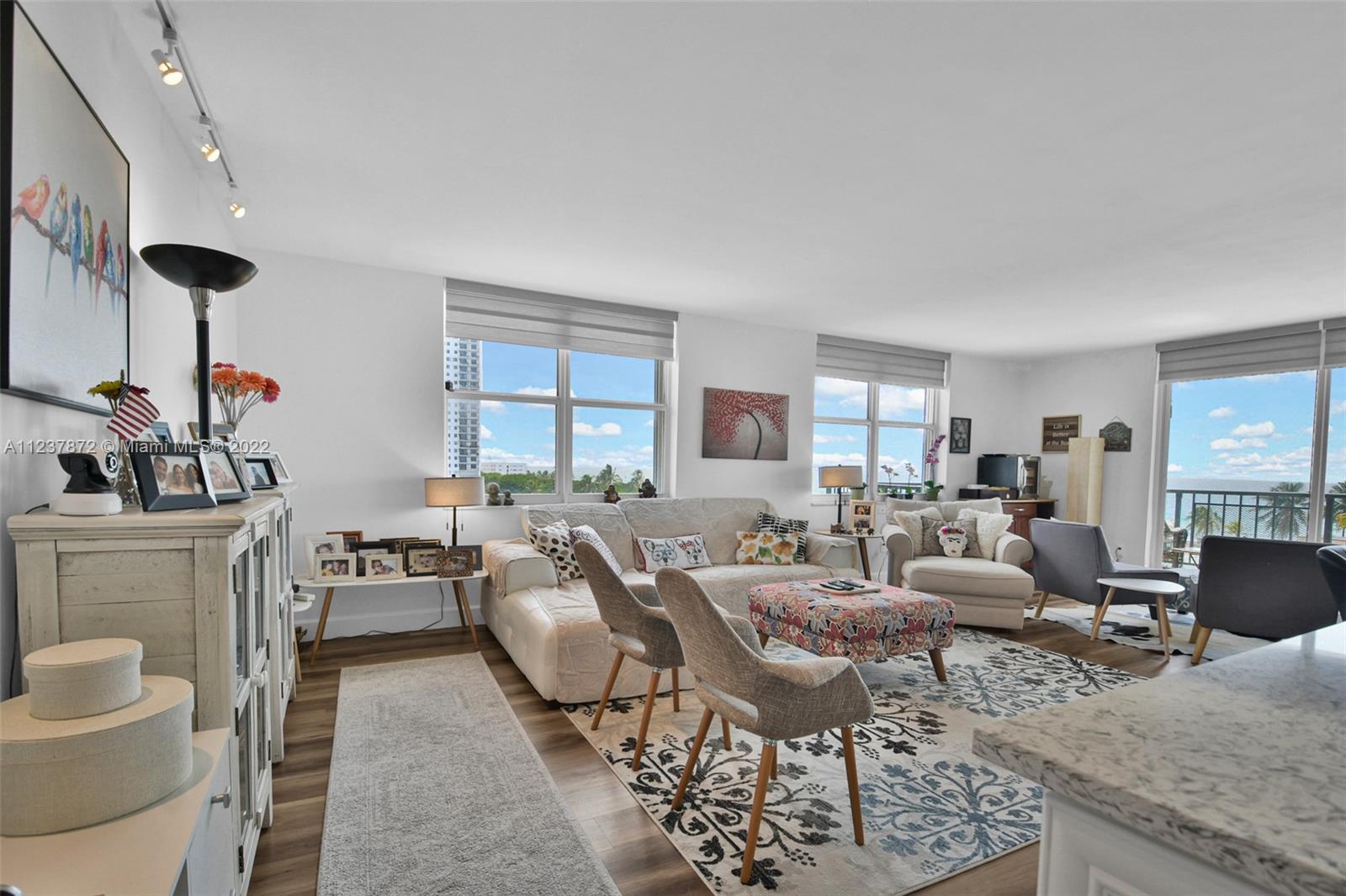 South Central Beach Hollywood, FL 33019 - Photo 7 of 30 a living room with fireplace furniture and a large window