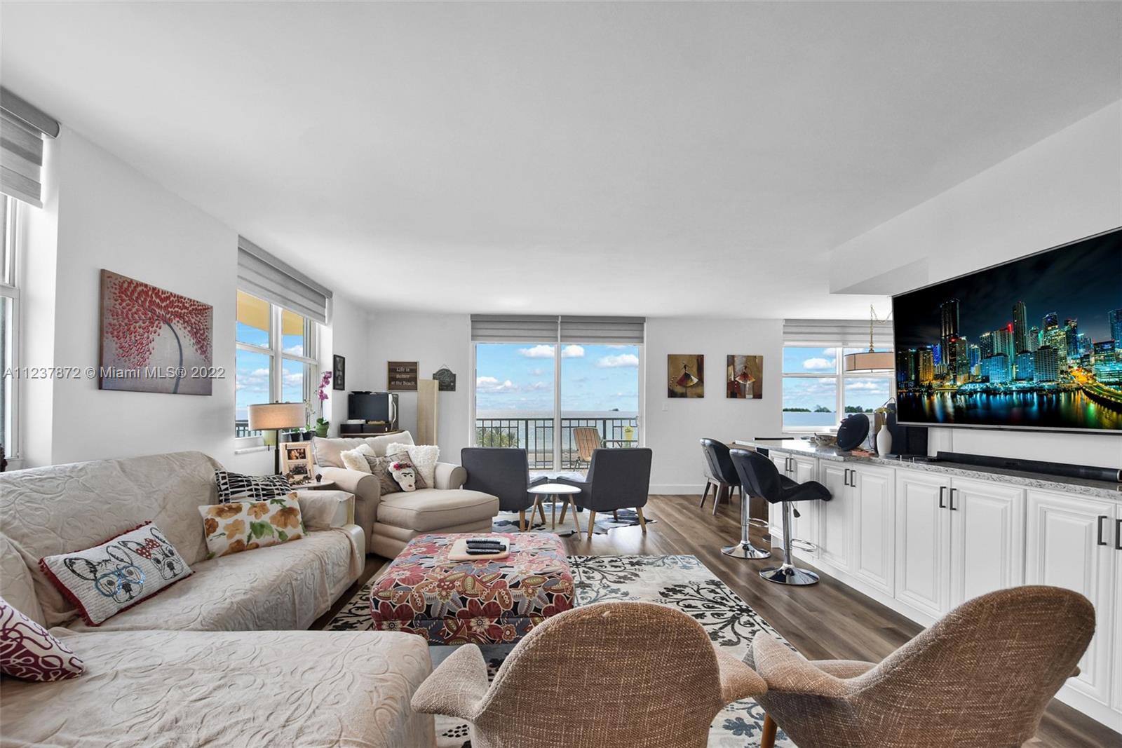 South Central Beach Hollywood, FL 33019 - Photo 9 of 30 a living room with furniture and a flat screen tv