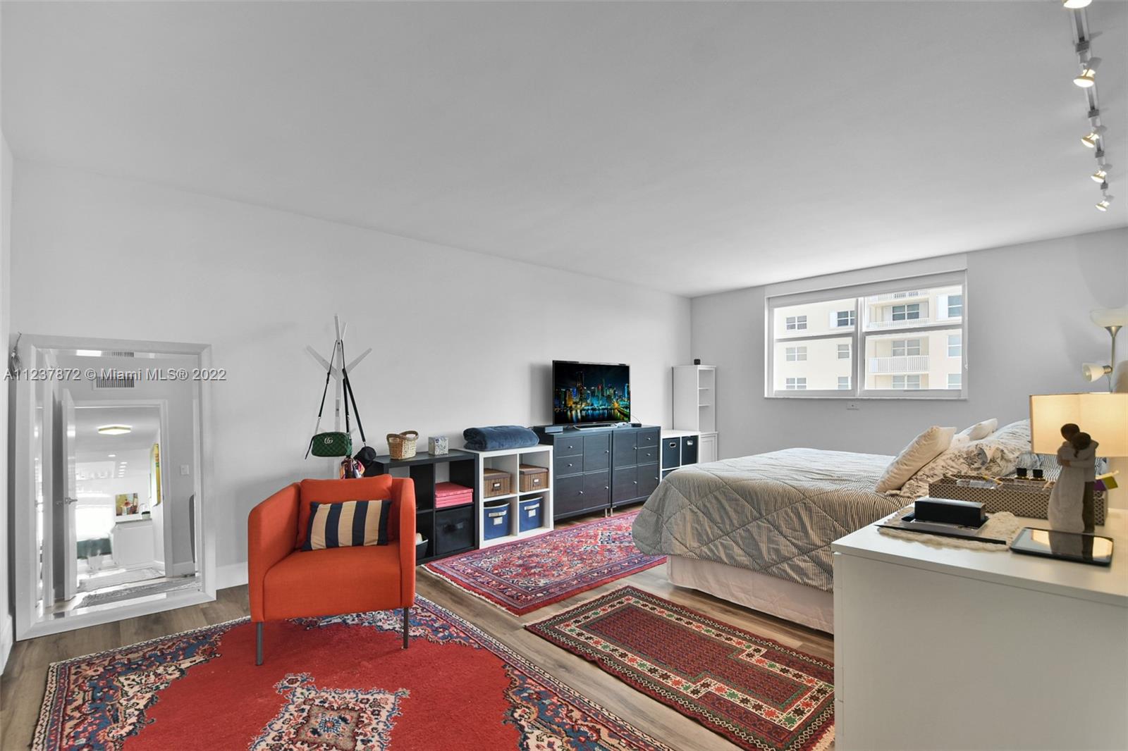 South Central Beach Hollywood, FL 33019 - Photo 10 of 30 a bedroom with furniture and a flat screen tv