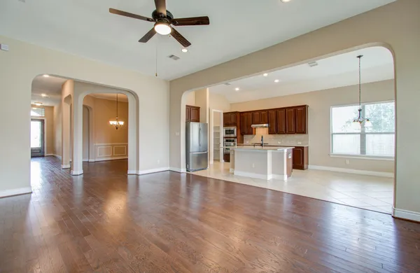 a view of a kitchen with a dishwasher cabinets and wooden floor