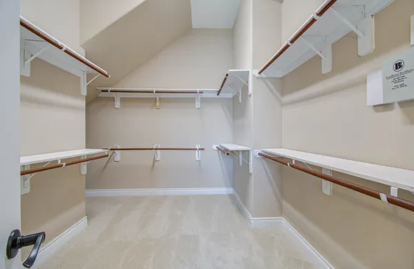 a view of an empty walk in closet