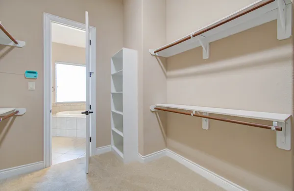 a view of walk in closet with window