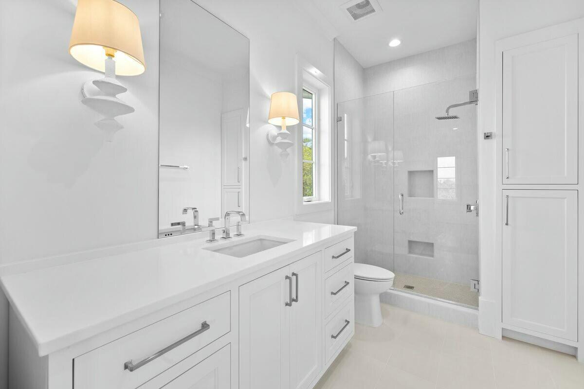 121 Old Beach Road Santa Rosa Beach, FL 32459 - Photo 36 of 69 a bathroom with a double vanity sink toilet and shower