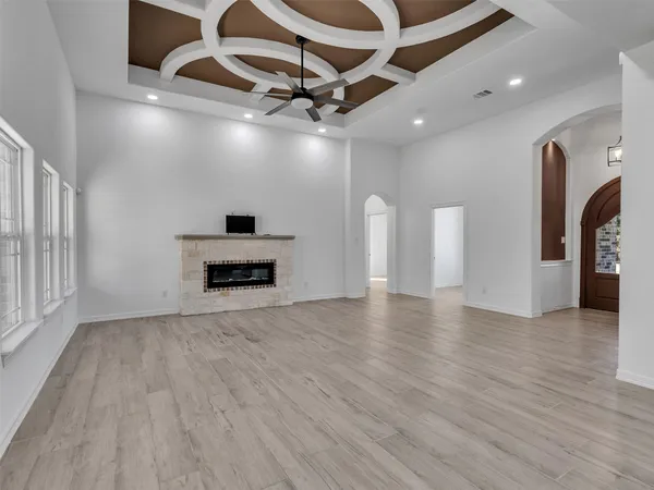 a view of an empty room with a fireplace
