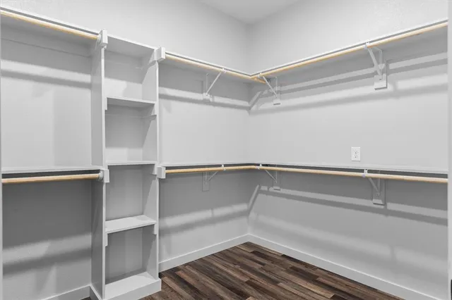 a view of an empty walk in closet