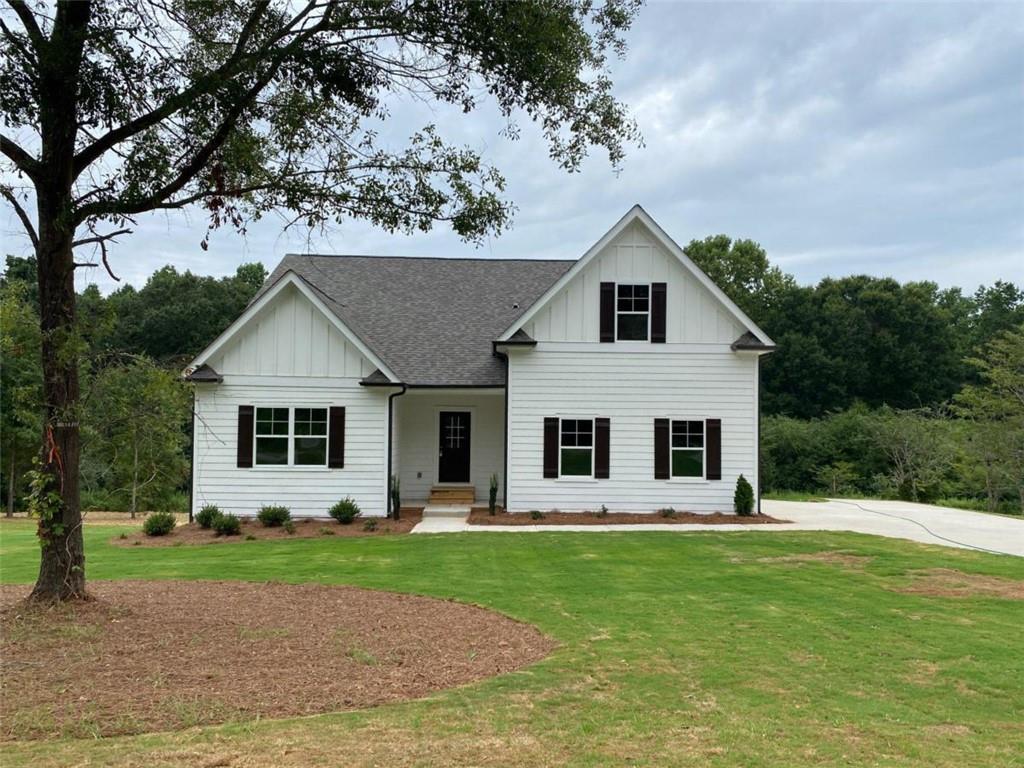 524 Elder Road Winder, GA 30680 - Photo 1 of 1 a front view of a house with garden