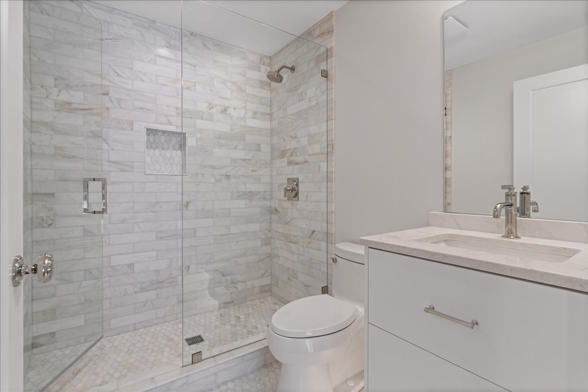 819 Wagner Road Glenview, IL 60025 - Photo 15 of 20 a bathroom with a sink toilet and shower