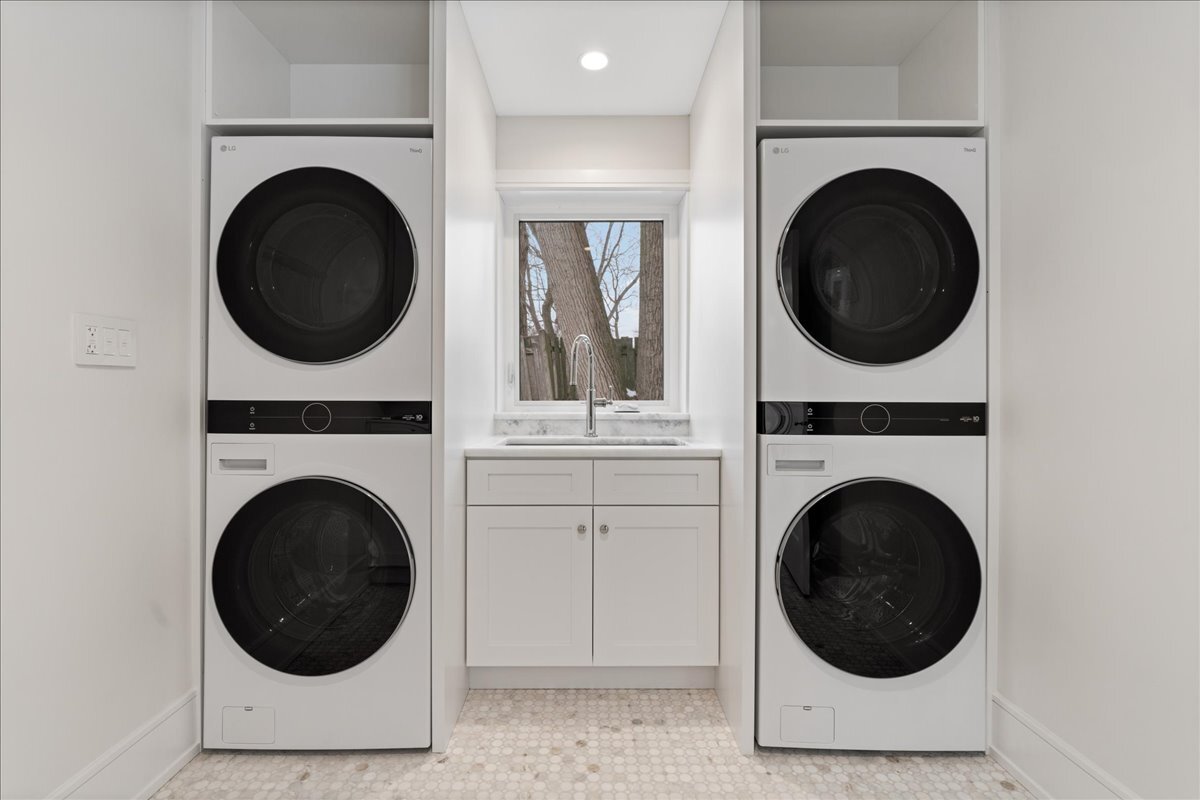819 Wagner Road Glenview, IL 60025 - Photo 17 of 20 a view of a hallway with washer and dryer