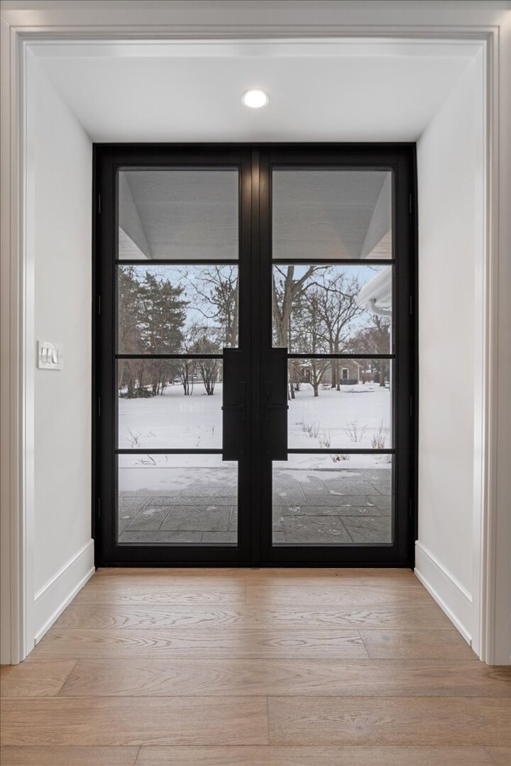 819 Wagner Road Glenview, IL 60025 - Photo 2 of 20 a view of a refrigerator in kitchen and wooden floor