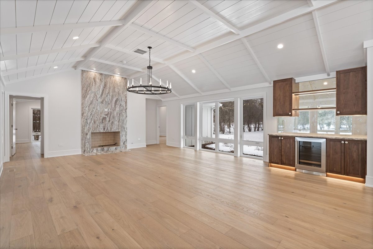 819 Wagner Road Glenview, IL 60025 - Photo 3 of 20 a room with stainless steel appliances kitchen island granite countertop a stove and cabinets with wooden floor