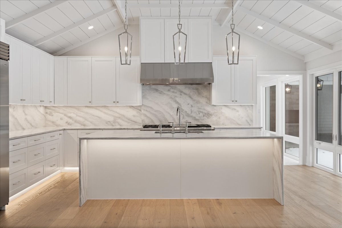 819 Wagner Road Glenview, IL 60025 - Photo 5 of 20 a kitchen with kitchen island granite countertop white cabinets and refrigerator